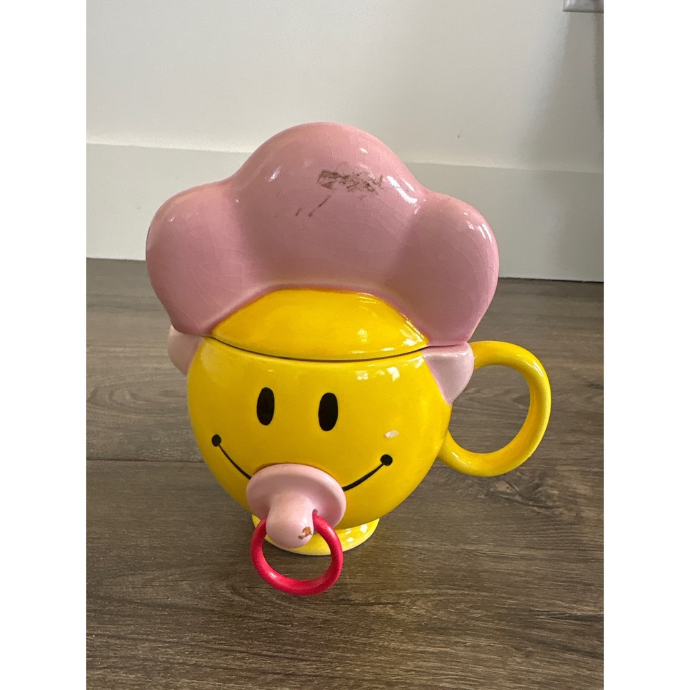 Teleflora Gift Smiley Face Baby Ceramic Mug with Pink Bonnet Lid and Pacifier